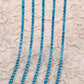chaine de strass en bleu-turquoise a griffe turquoise 