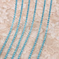 chaine de strass turquoise-claire azur a griffe bleu