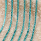 chaine de strass en vert-cyan a griffe cyan