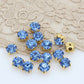 strass bleu azur claire, griffe en métal doré a coudre