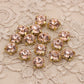 strass rose corail, griffe en métal doré a coudre