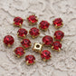 strass rouge foncé , griffe en métal doré a coudre