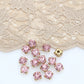 strass rose , griffe en métal a coudre
