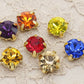 présentation de strass et c'est couleur, griffe en métal doré a coudre